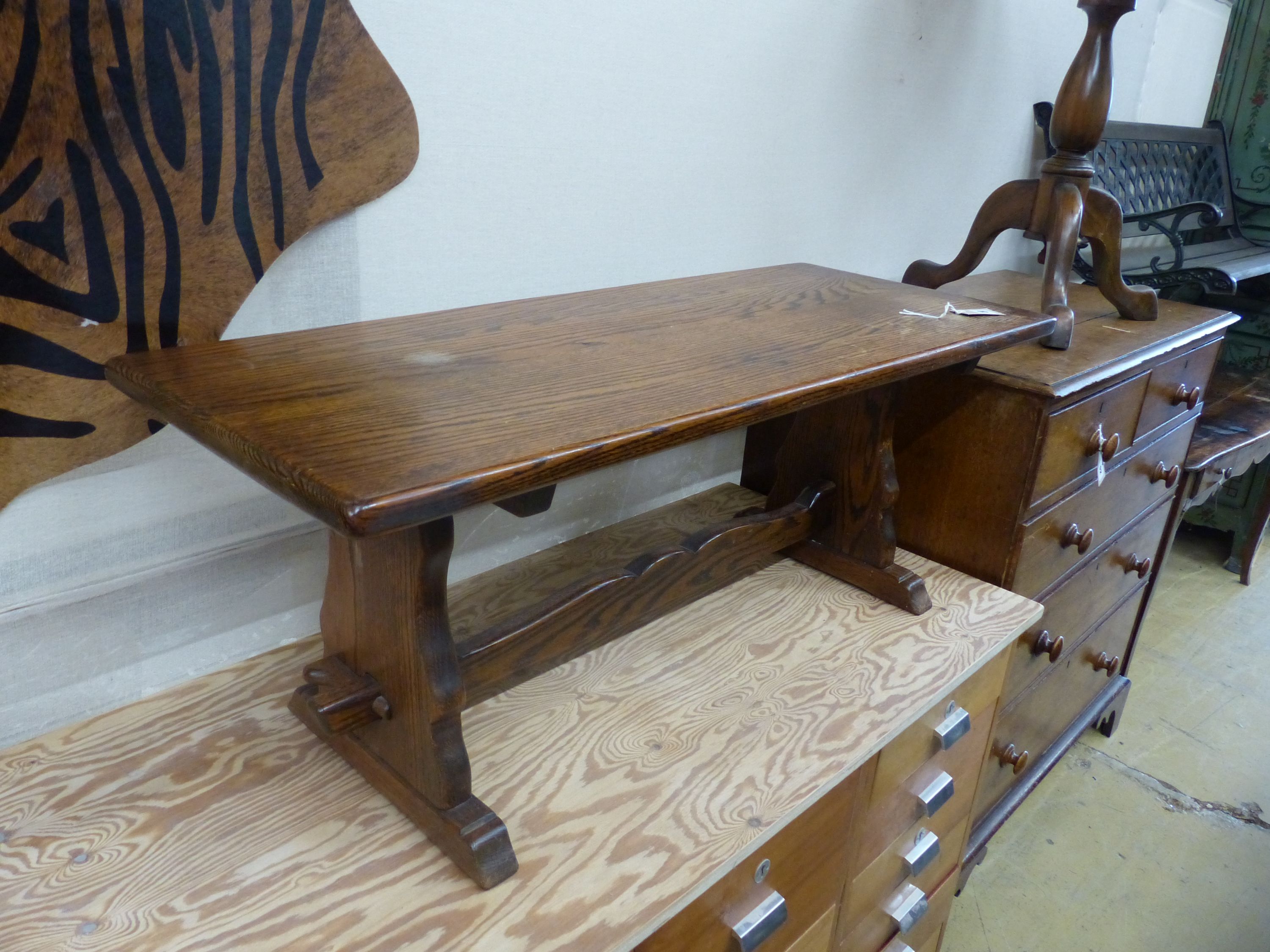 A circular mahogany occasional table on tripod base, diameter 60cm, height 70cm together with a rectangular oak low occasional table, width 106cm, height 42cm